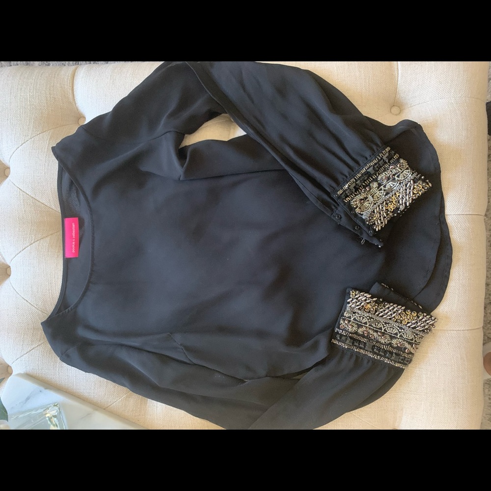 Black blouse with slit in both arms & beaded wrist